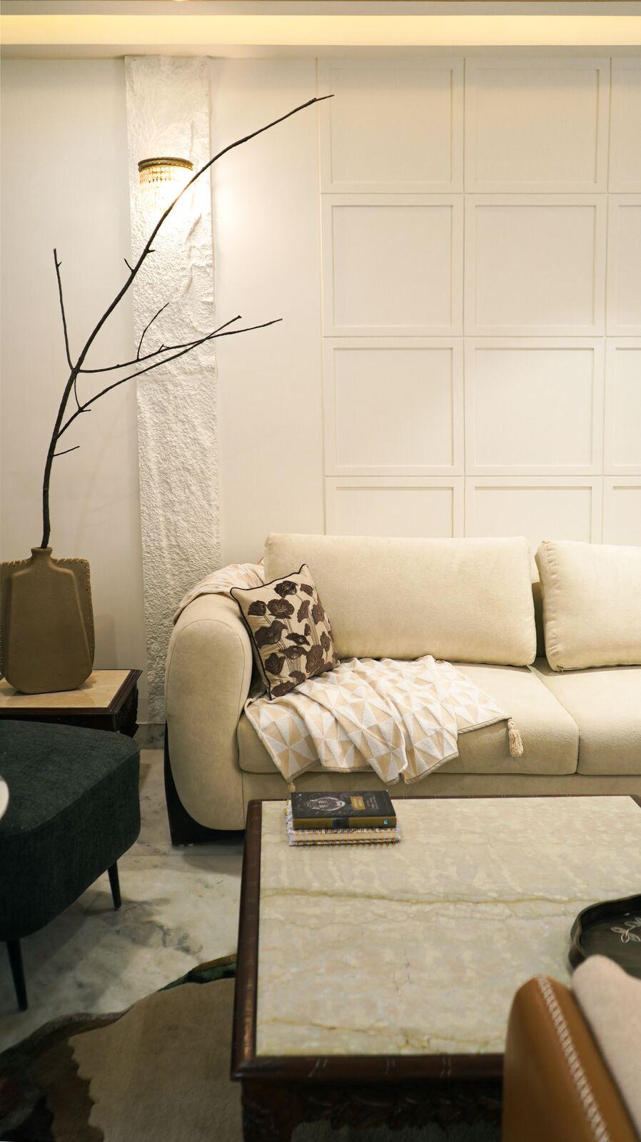 Samsara Residence living room with textured stone accent wall